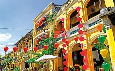 Colourful buildings and strings of lanterns in Hoi An